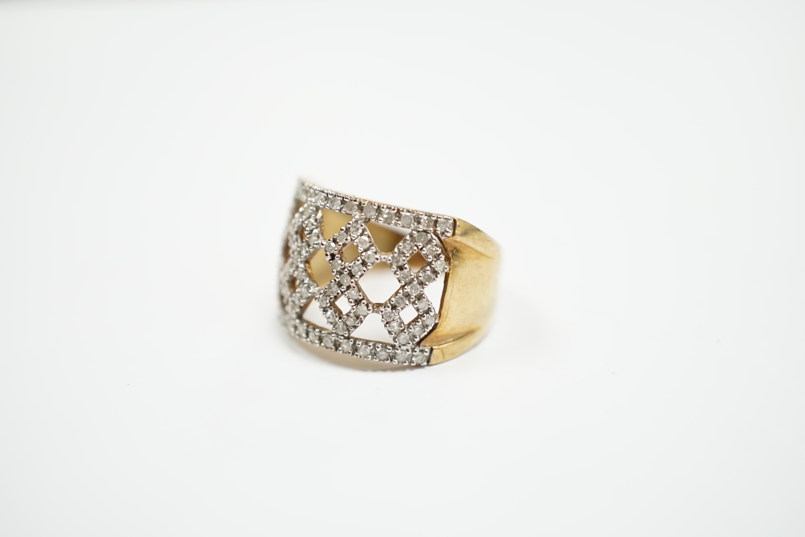 A modern 9ct gold and diamond chip cluster set dress ring, size P, gross weight 4.8 grams.